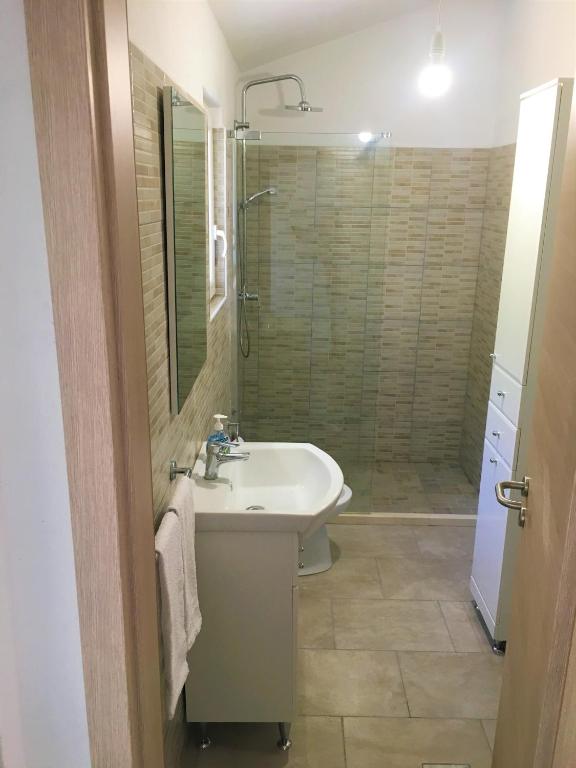 Kúpeľňa v ubytovaní Apartments Kurelja