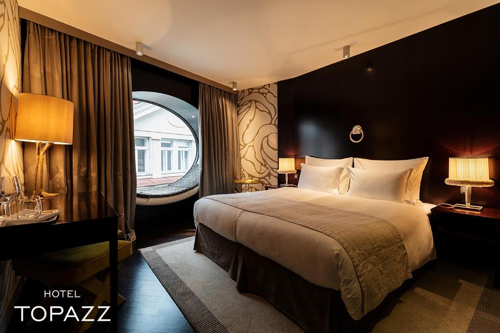Postel nebo postele na pokoji v ubytování Hotel Topazz & Lamée