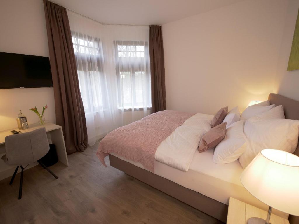 Postel nebo postele na pokoji v ubytování Oberwaldhaus