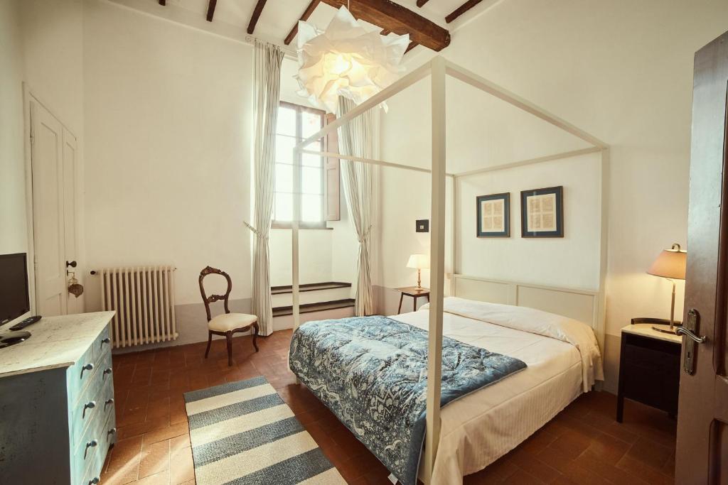 Postel nebo postele na pokoji v ubytování Agriturismo Villa Buoninsegna