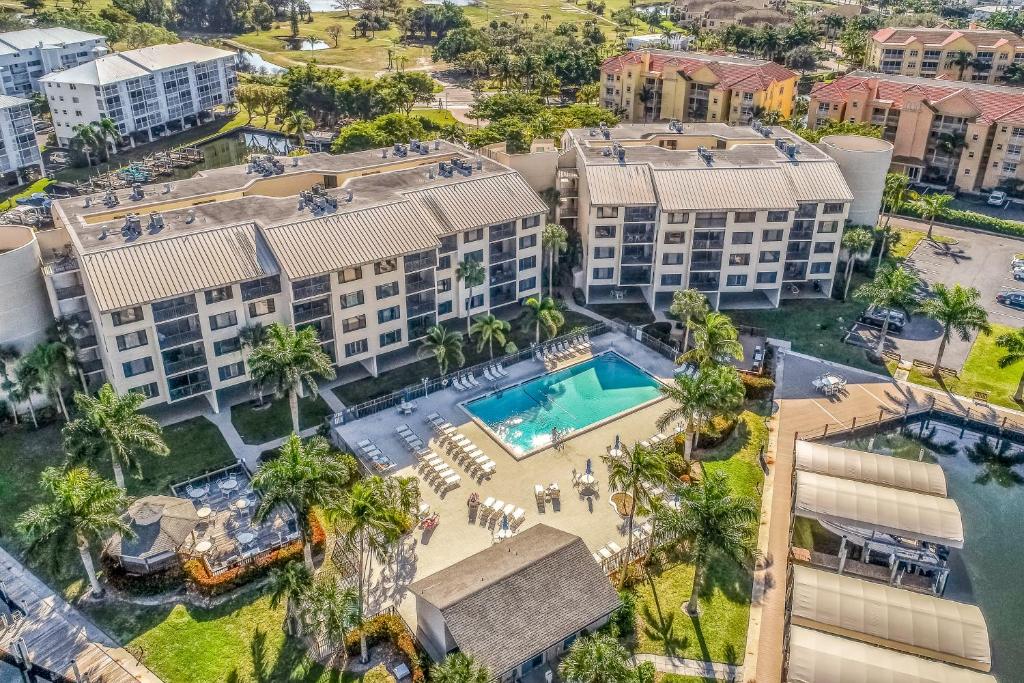 an aerial view of a resort with a swimming pool at Ocean Breeze & Santa Maria Condos in Fort Myers Beach