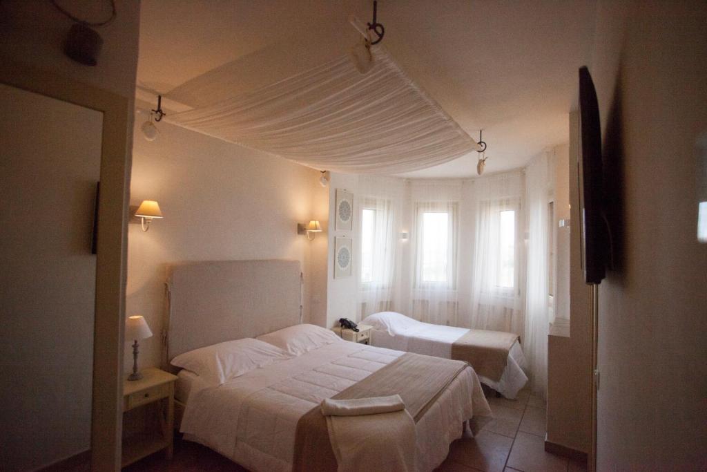 Postel nebo postele na pokoji v ubytování Relais in Contrada