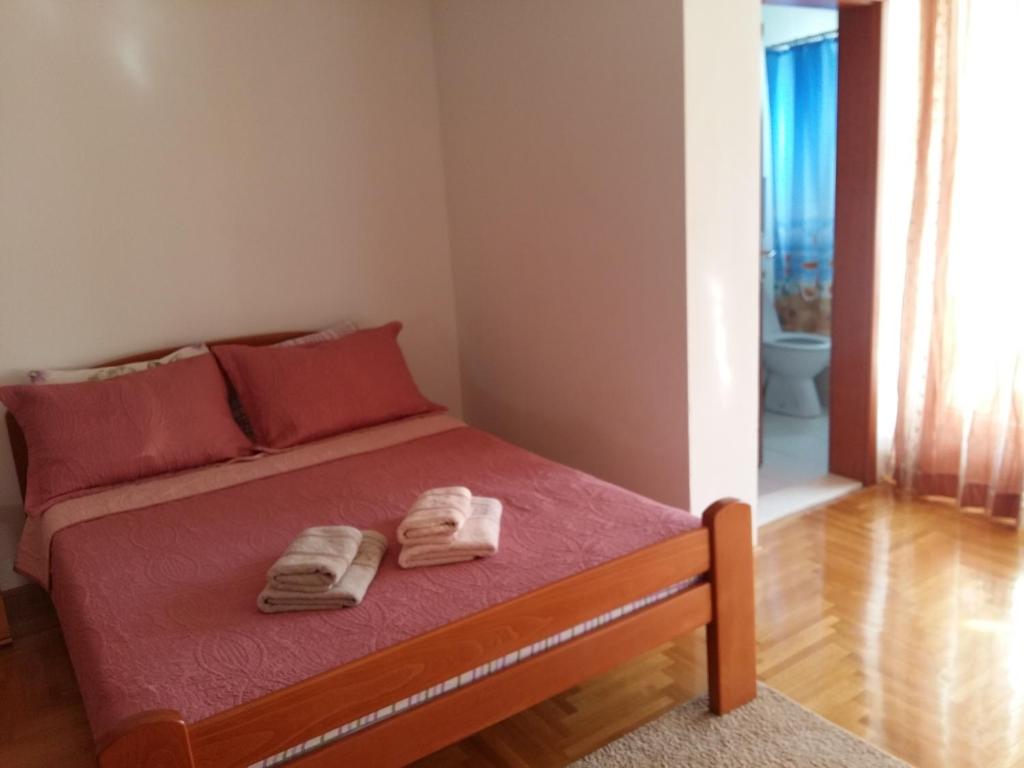 Voodi või voodid majutusasutuse Lazar Apartments toas