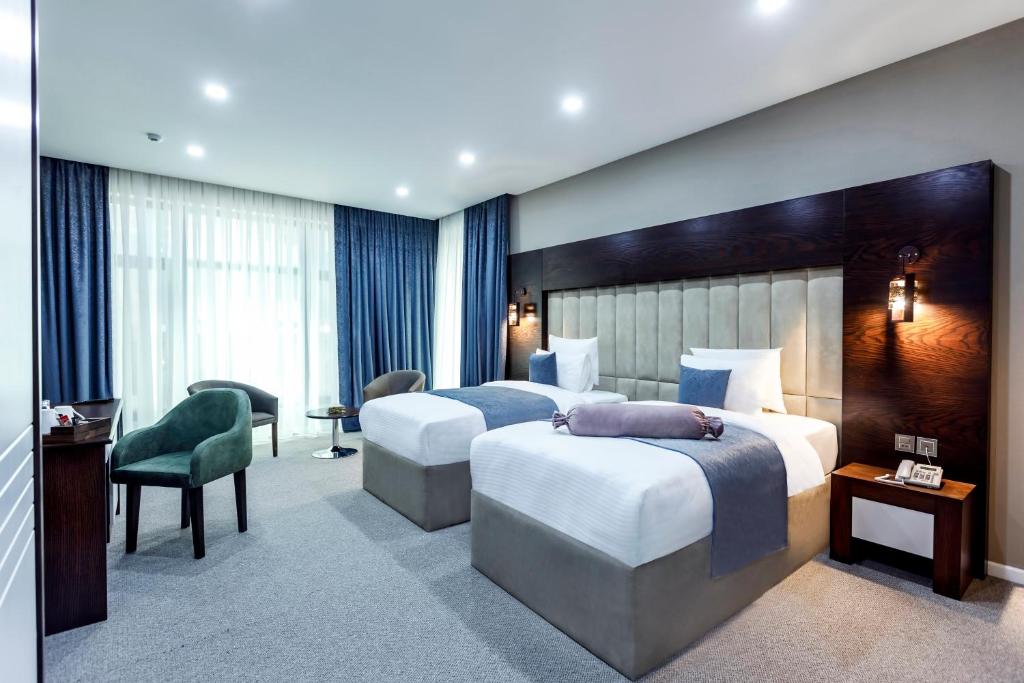 Krevet ili kreveti u jedinici u okviru objekta Parallel Hotel