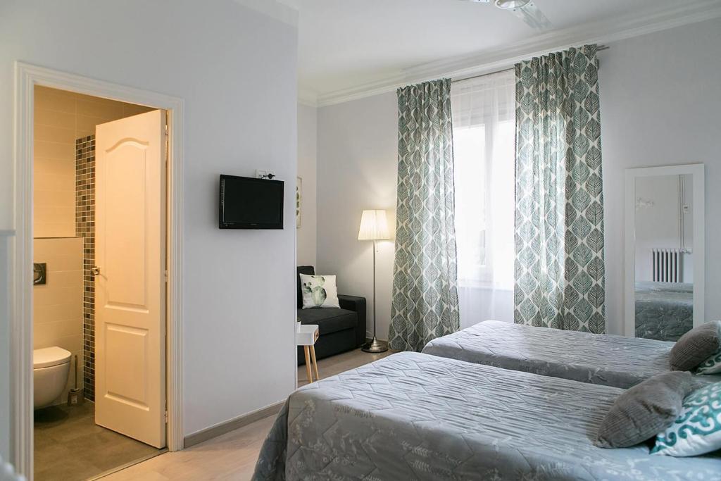 Postel nebo postele na pokoji v ubytování Blanc Guest House
