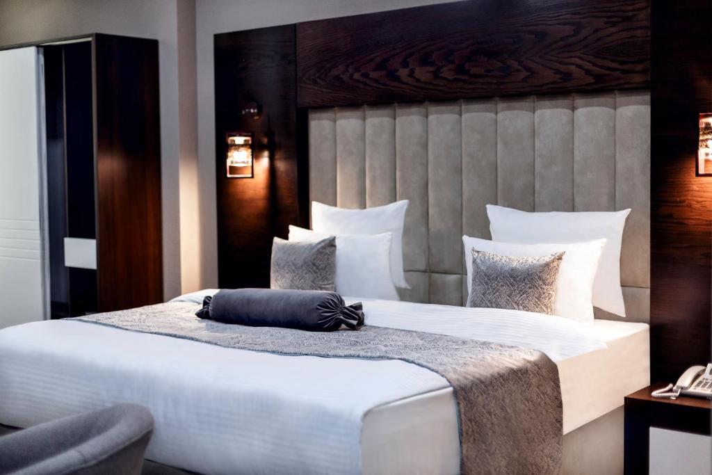 Krevet ili kreveti u jedinici u okviru objekta Parallel Hotel