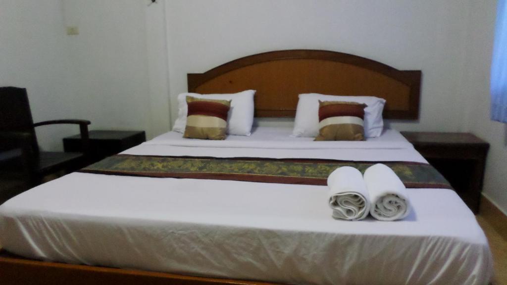 Postel nebo postele na pokoji v ubytování Aonang SR Bungalows