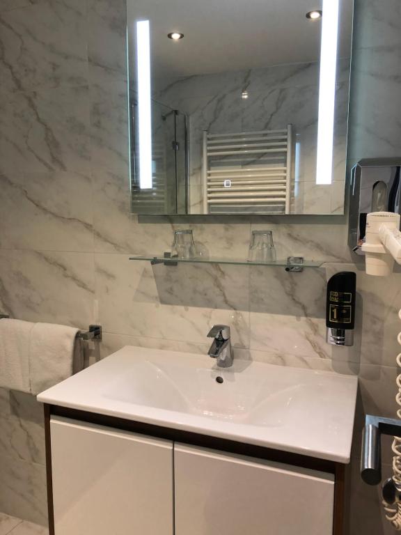Koupelna v ubytování Hotel König