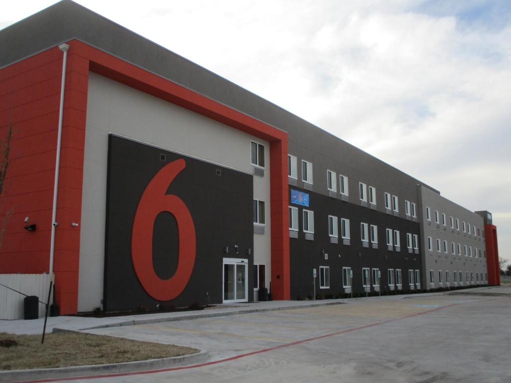 a building with a large number painted on the side at Studio 6-Corpus Christi, TX in Corpus Christi