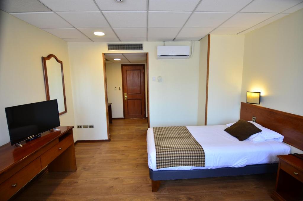 Postel nebo postele na pokoji v ubytování Tur Hotel Santiago
