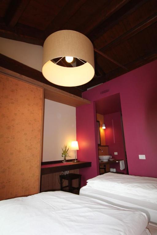 Llit o llits en una habitació de Agriturismo Tetto Garrone