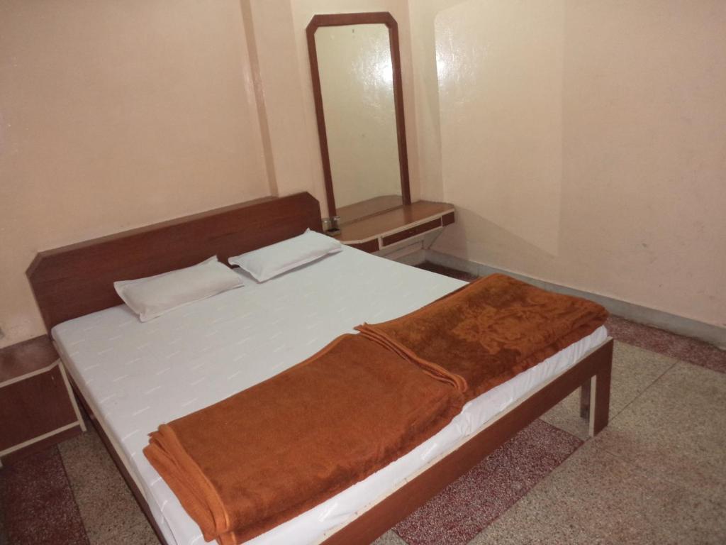 Кровать или кровати в номере Vijay Palace