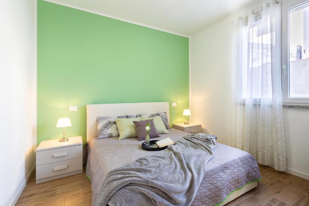 En eller flere senge i et værelse på Casa Olivastro Millenario A