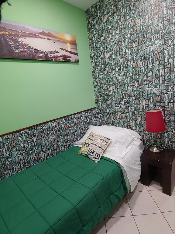 Postel nebo postele na pokoji v ubytování Sorrento Relais
