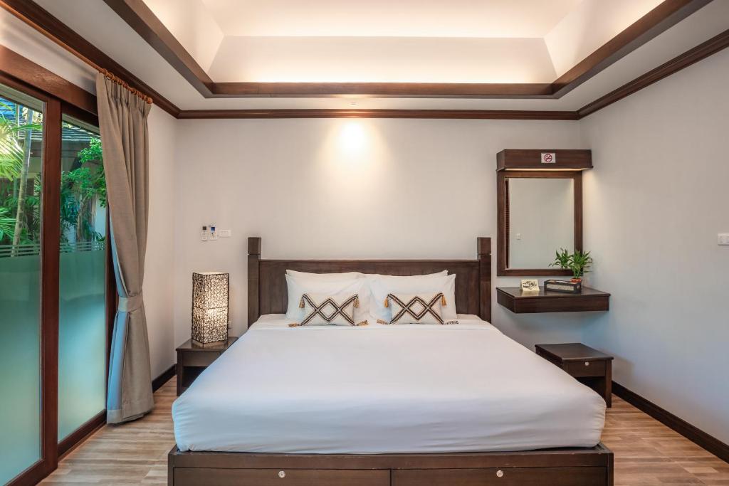 Ein Bett oder Betten in einem Zimmer der Unterkunft Pai Tan Villas - SHA Extra Plus