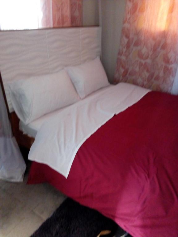Postel nebo postele na pokoji v ubytování Serene Homes