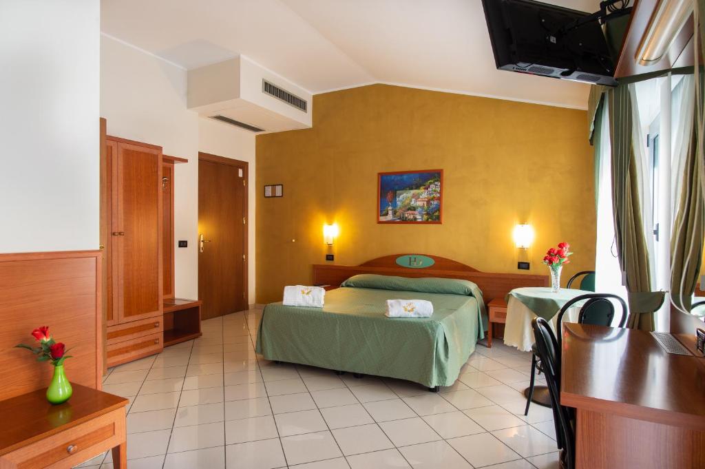 Posteľ alebo postele v izbe v ubytovaní Hotel Dorè