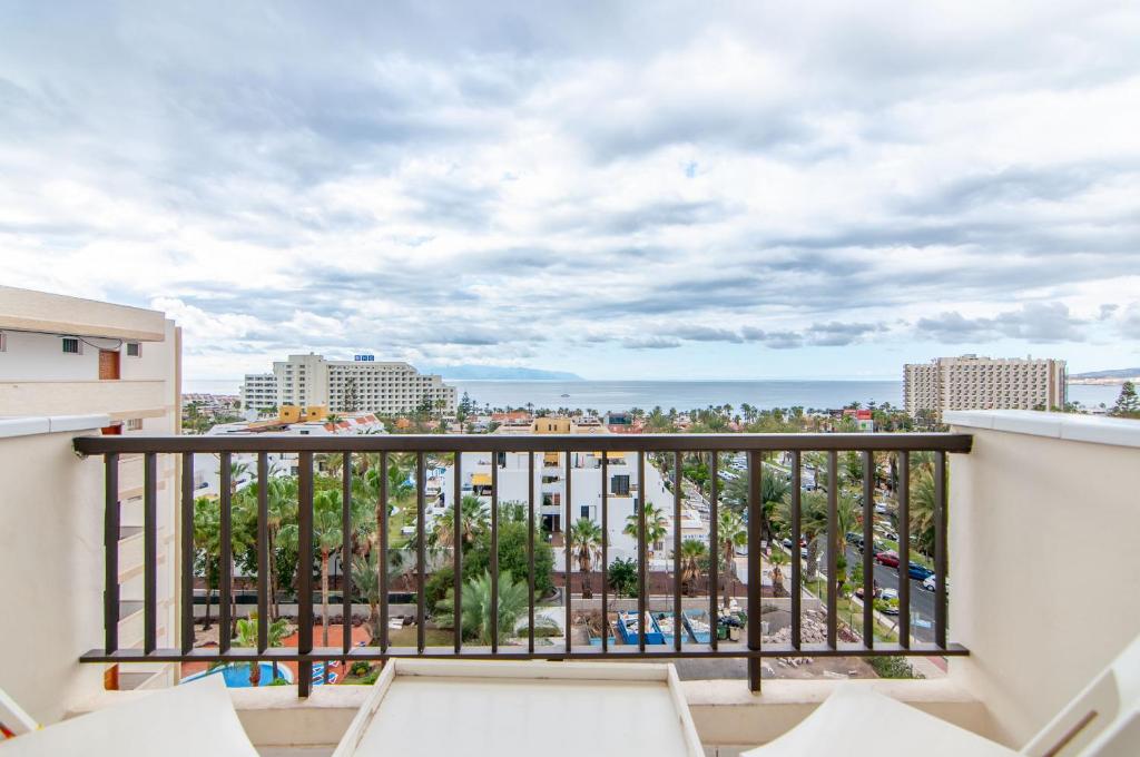 a balcony with a view of the beach and buildings at EL DORADO SEA VIEW 2A015 in Arona