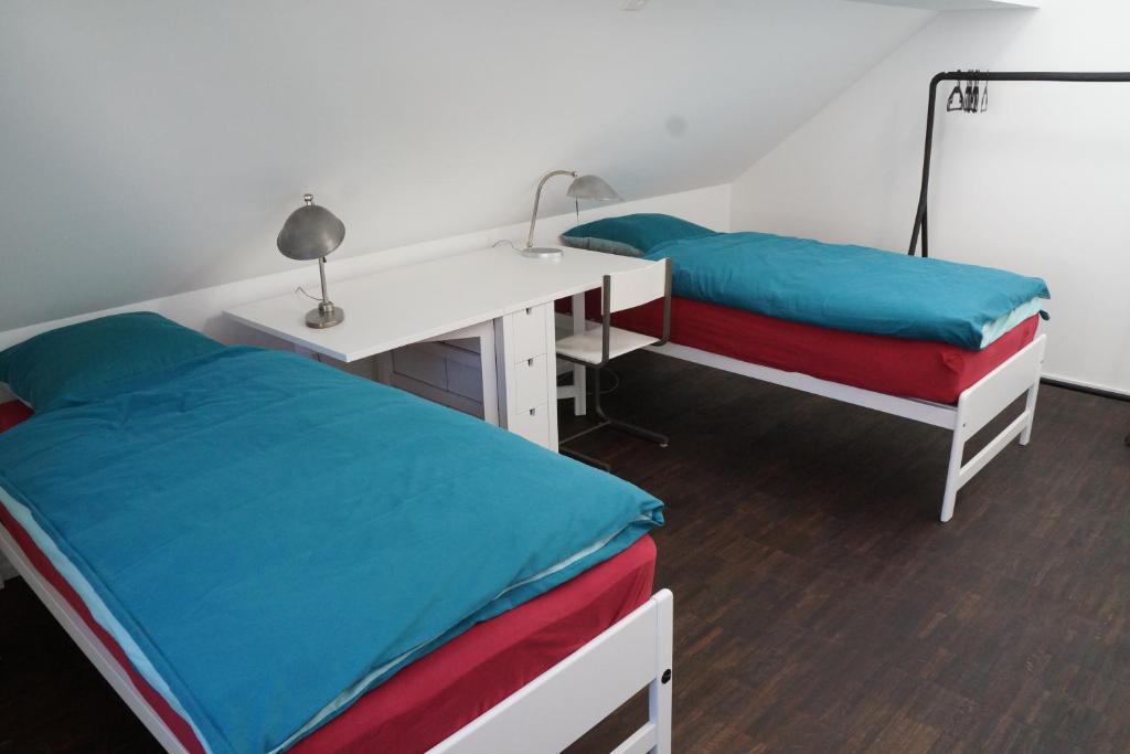 Postel nebo postele na pokoji v ubytování Ackaert Ferienwohnung Top of Thun