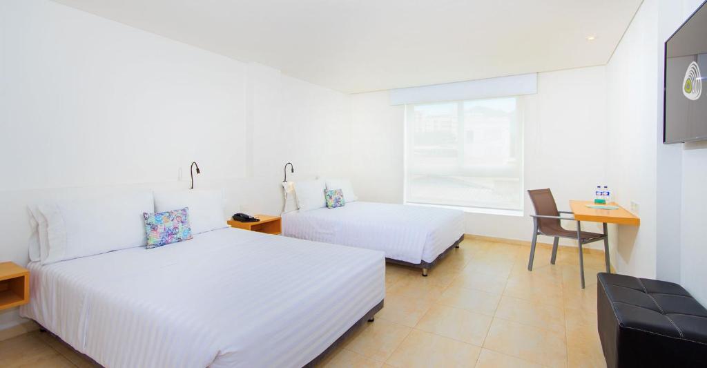 Postel nebo postele na pokoji v ubytování Del Mar Hotel