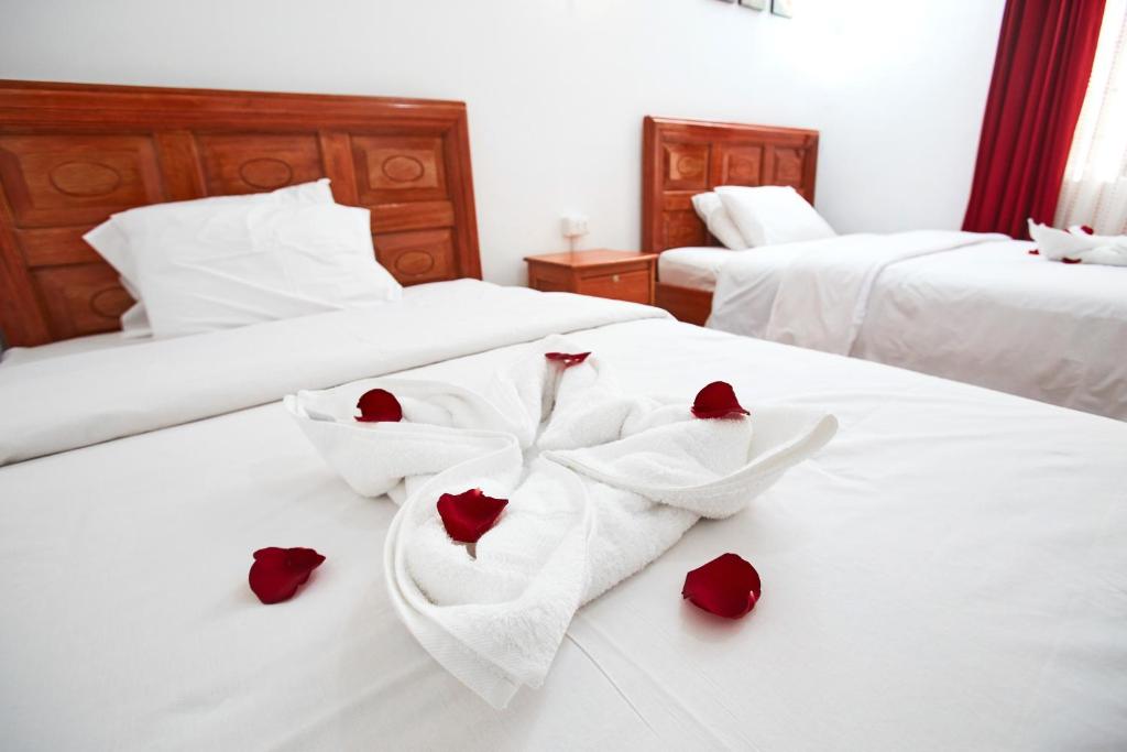 Postel nebo postele na pokoji v ubytování Hostal Danna Inn
