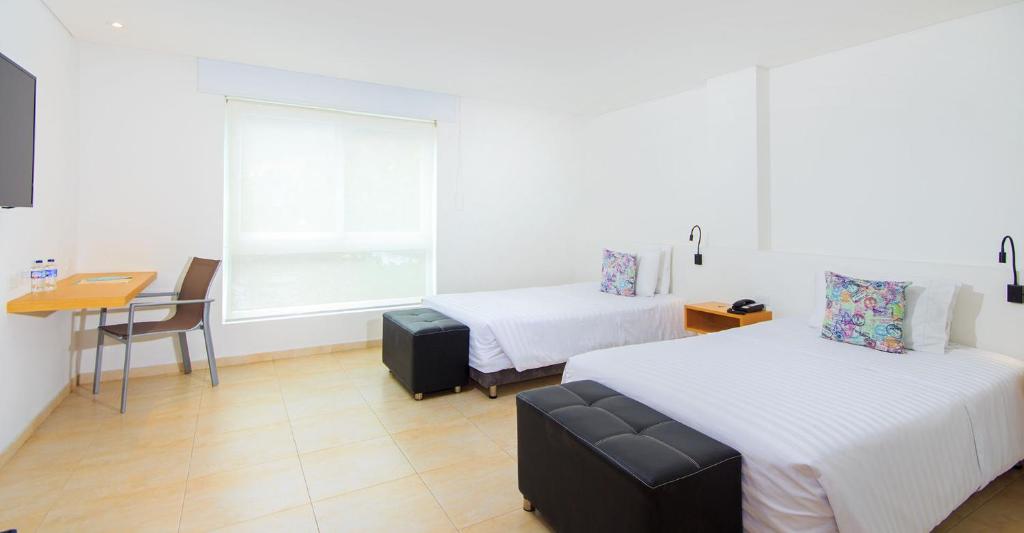 Postel nebo postele na pokoji v ubytování Del Mar Hotel