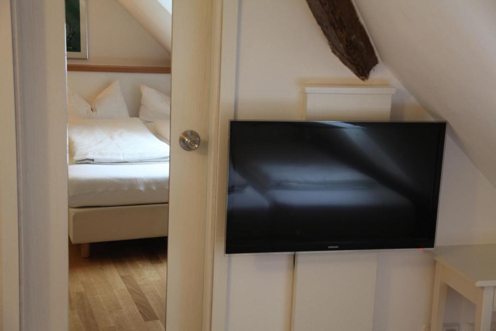 Postel nebo postele na pokoji v ubytování Hotel Bacchus Wine & Bites