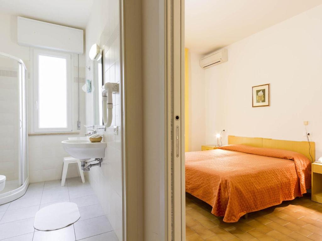 Postel nebo postele na pokoji v ubytování Hotel Meris
