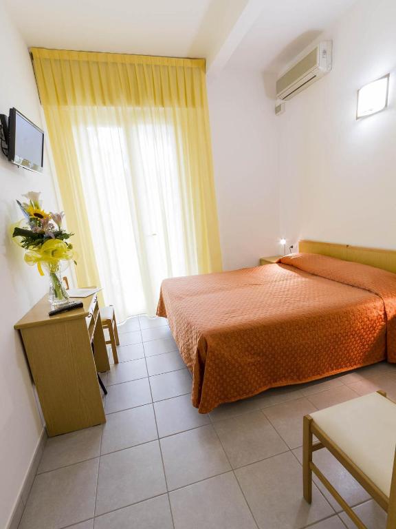 Postel nebo postele na pokoji v ubytování Hotel Meris