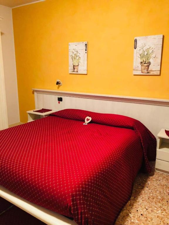 Postel nebo postele na pokoji v ubytování Albergo Corte di Emma