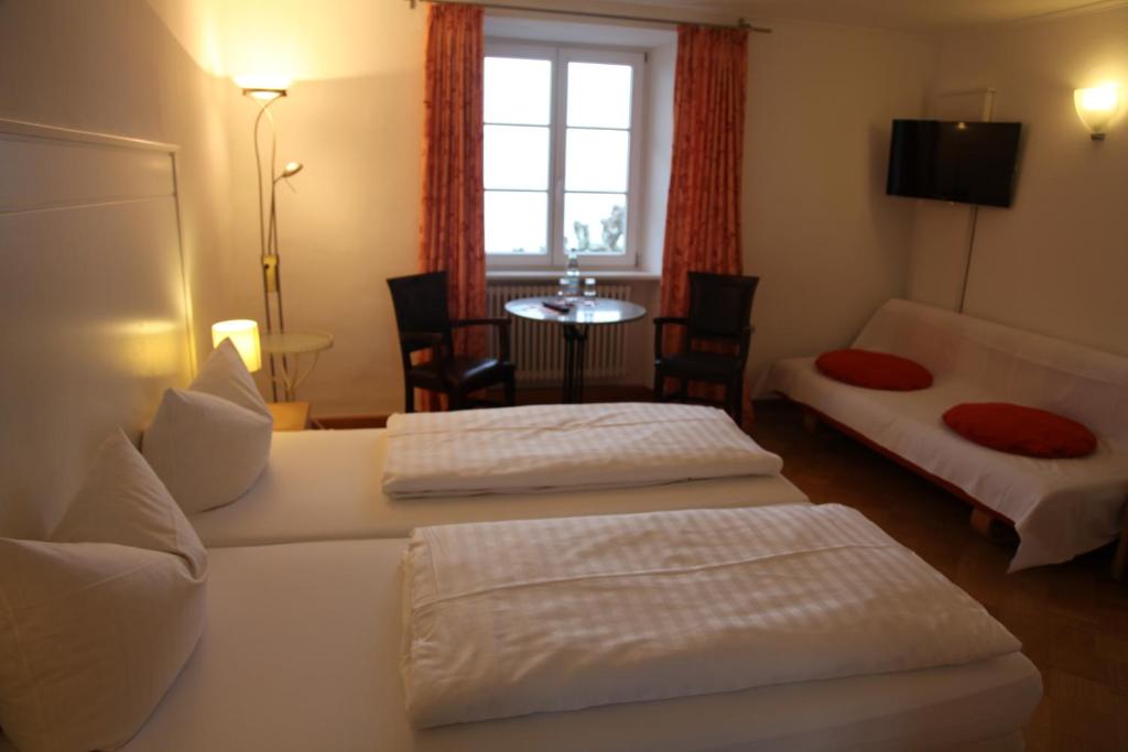Postel nebo postele na pokoji v ubytování Hotel Bacchus Wine & Bites