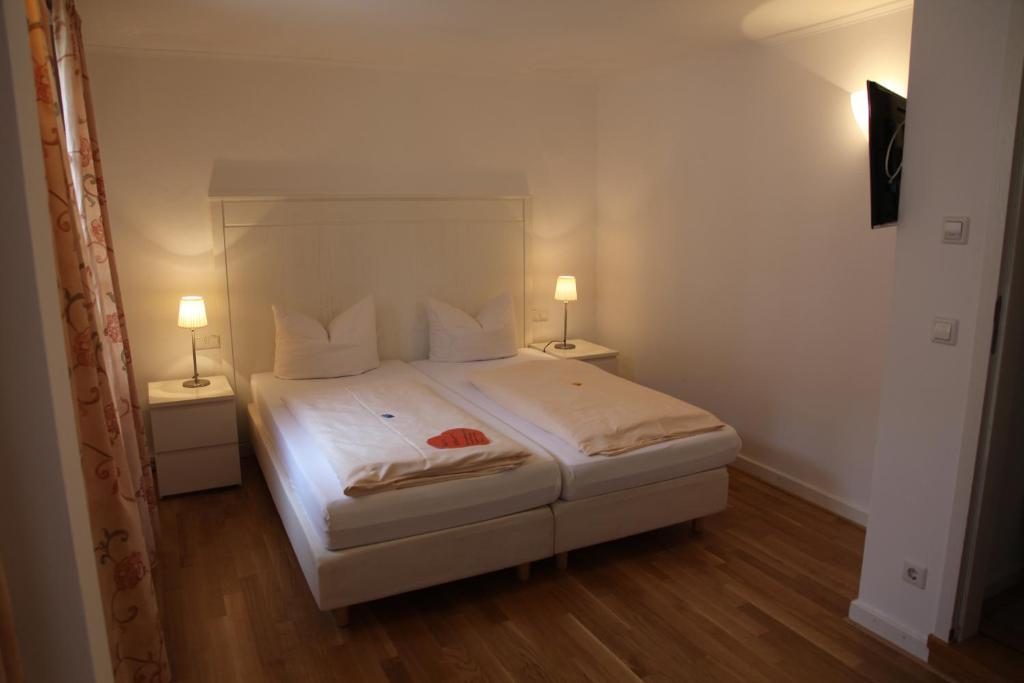 Postel nebo postele na pokoji v ubytování Hotel Bacchus Wine & Bites