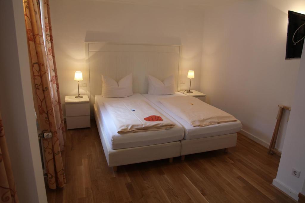 Postel nebo postele na pokoji v ubytování Hotel Bacchus Wine & Bites