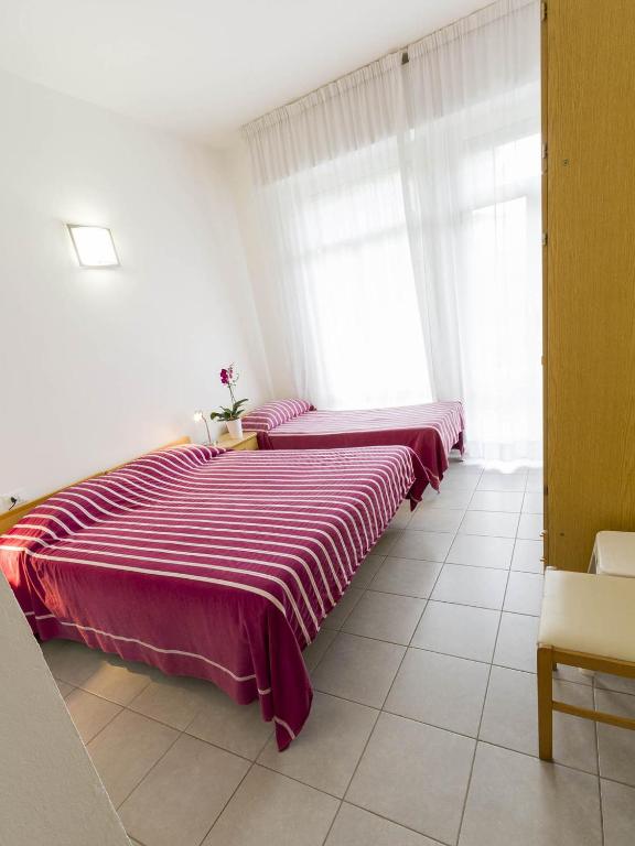 Postel nebo postele na pokoji v ubytování Hotel Meris
