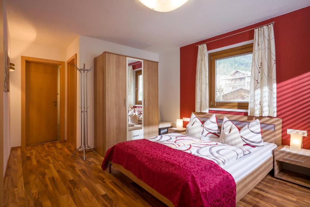 Postel nebo postele na pokoji v ubytování Appartements Enzian