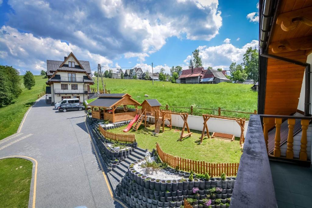 an aerial view of a playground in front of a house at Willa Tatra House in Zakopane