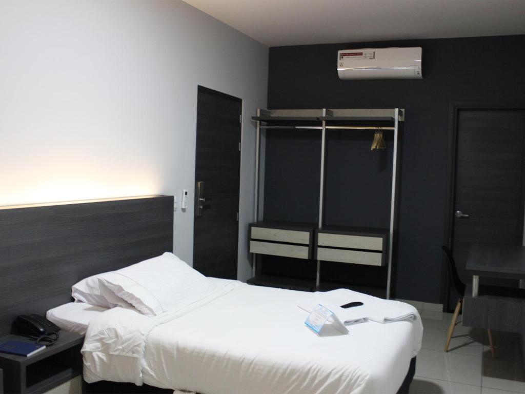 Postel nebo postele na pokoji v ubytování Hotel Doral Inn