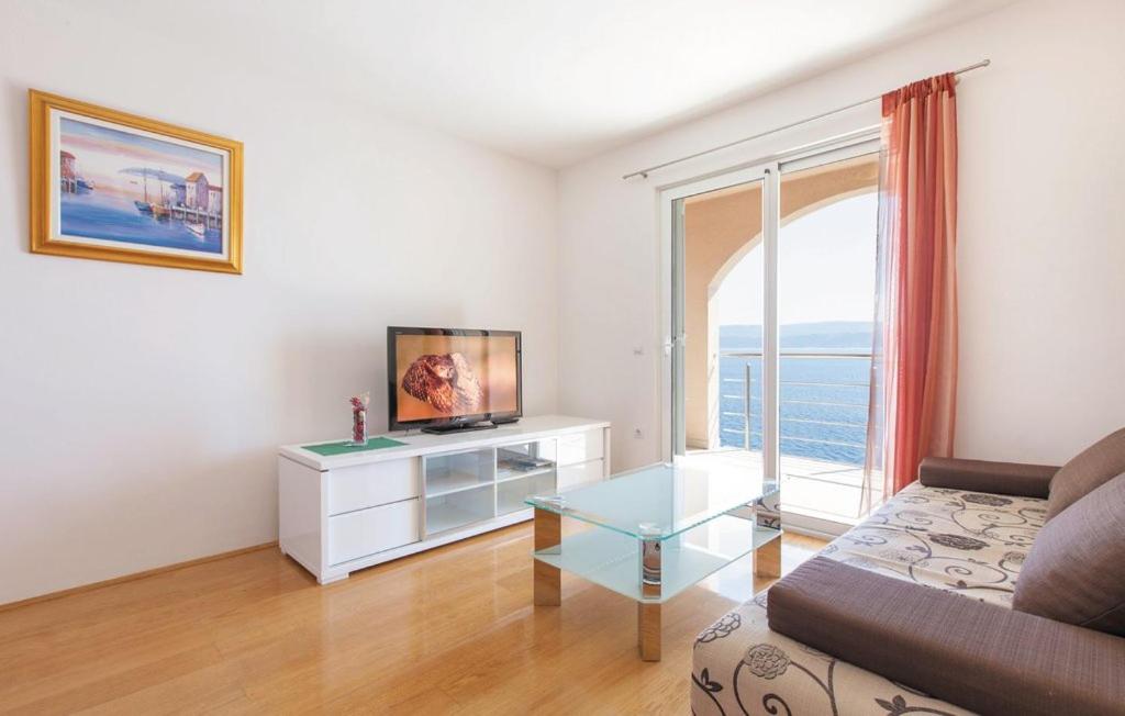 Televízia a/alebo spoločenská miestnosť v ubytovaní Apartments Villa Amalia
