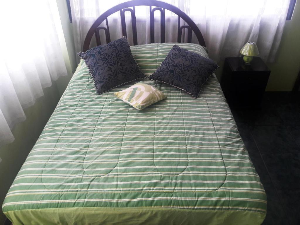 Postel nebo postele na pokoji v ubytování Hostal Haziel