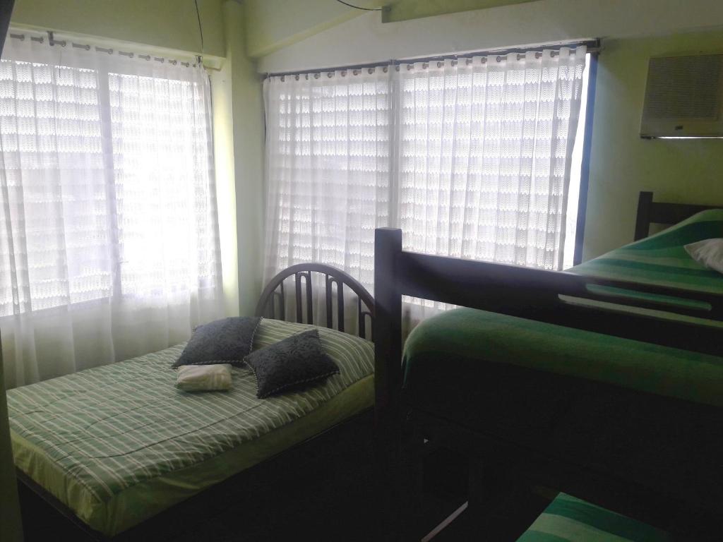 Postel nebo postele na pokoji v ubytování Hostal Haziel