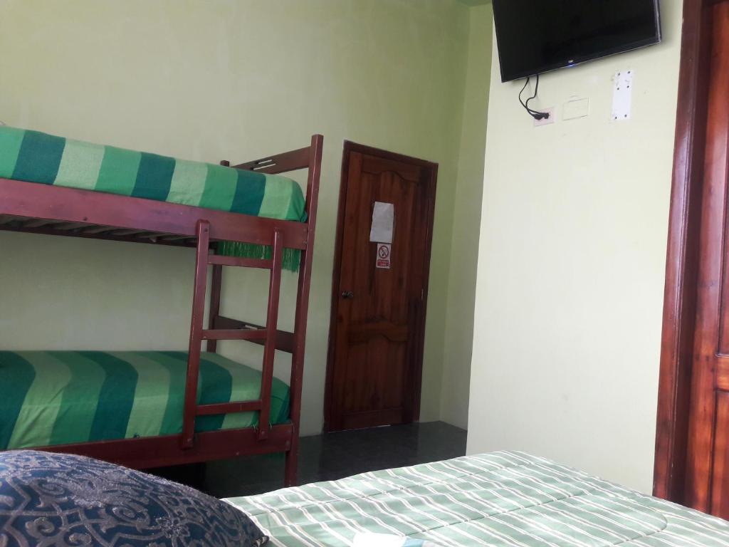 Postel nebo postele na pokoji v ubytování Hostal Haziel