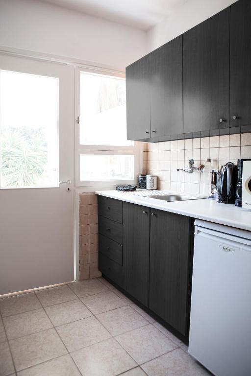 Kuchyňa alebo kuchynka v ubytovaní Best located executive apartment in Maroussi.