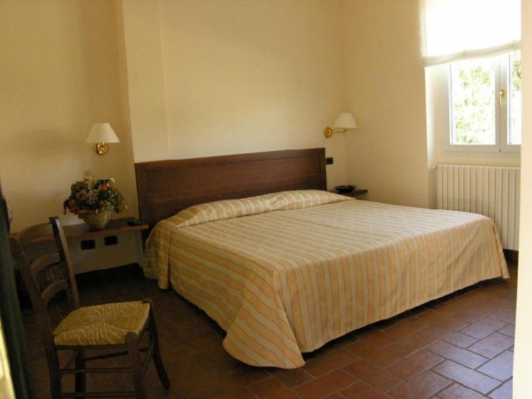 Katil atau katil-katil dalam bilik di Locanda Verbena