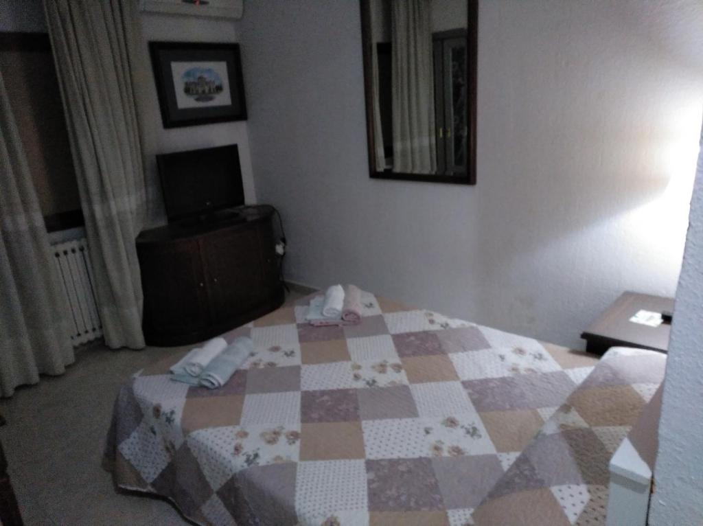 Posteľ alebo postele v izbe v ubytovaní Hotel Nuevo Ara