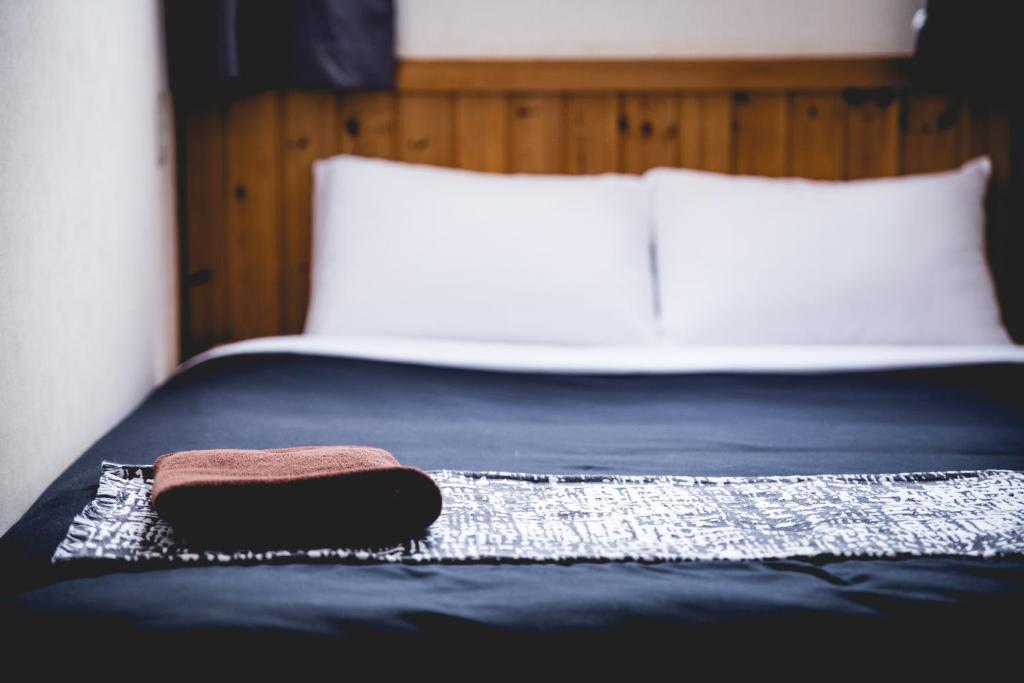 Postel nebo postele na pokoji v ubytování Hakuba Cortina Lodge