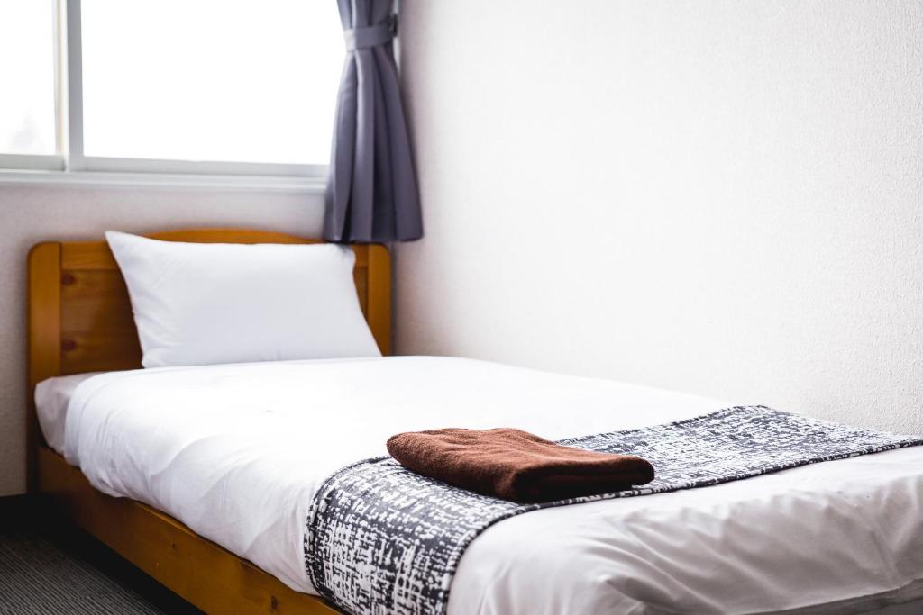 Postel nebo postele na pokoji v ubytování Hakuba Cortina Lodge