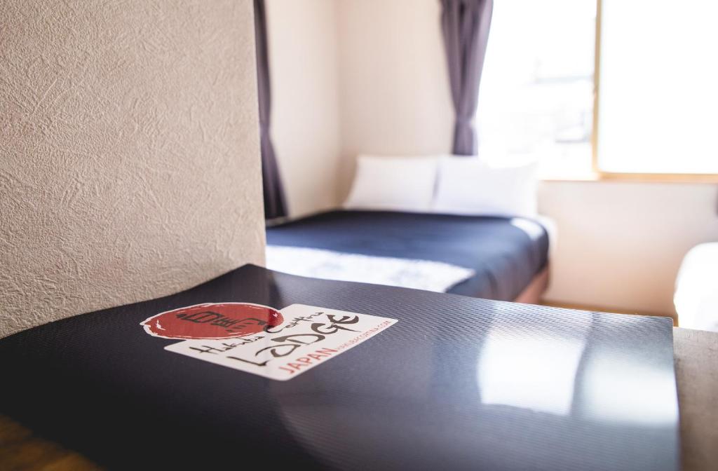 Postel nebo postele na pokoji v ubytování Hakuba Cortina Lodge