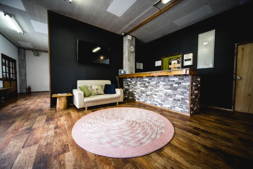 Posezení v ubytování Hakuba Cortina Lodge