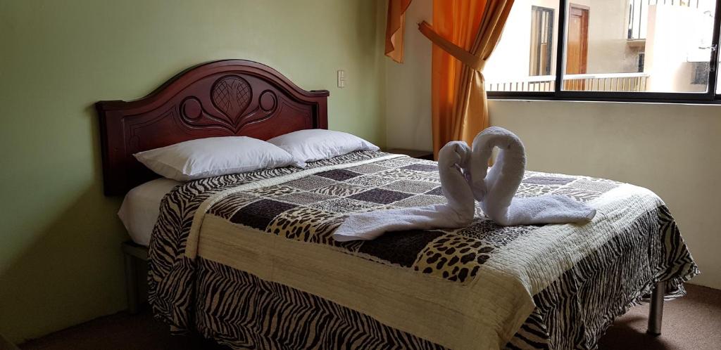 Postel nebo postele na pokoji v ubytování Hostal Pucará