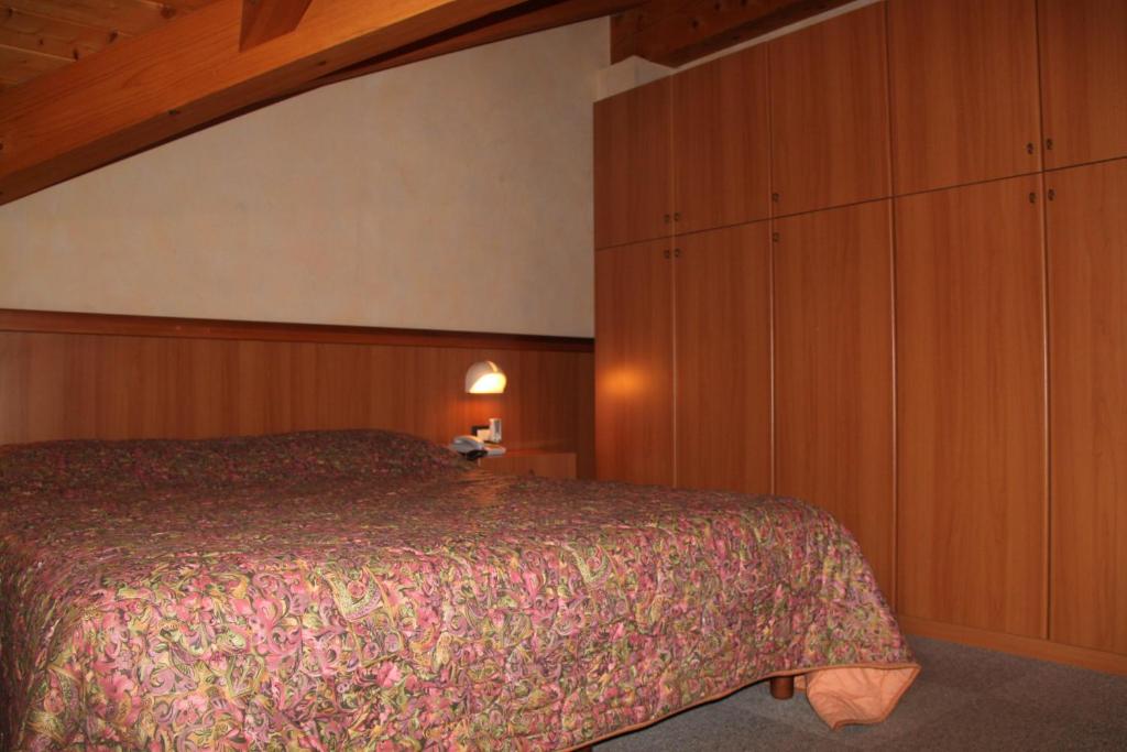 Postel nebo postele na pokoji v ubytování Garnì Goccia d'Oro